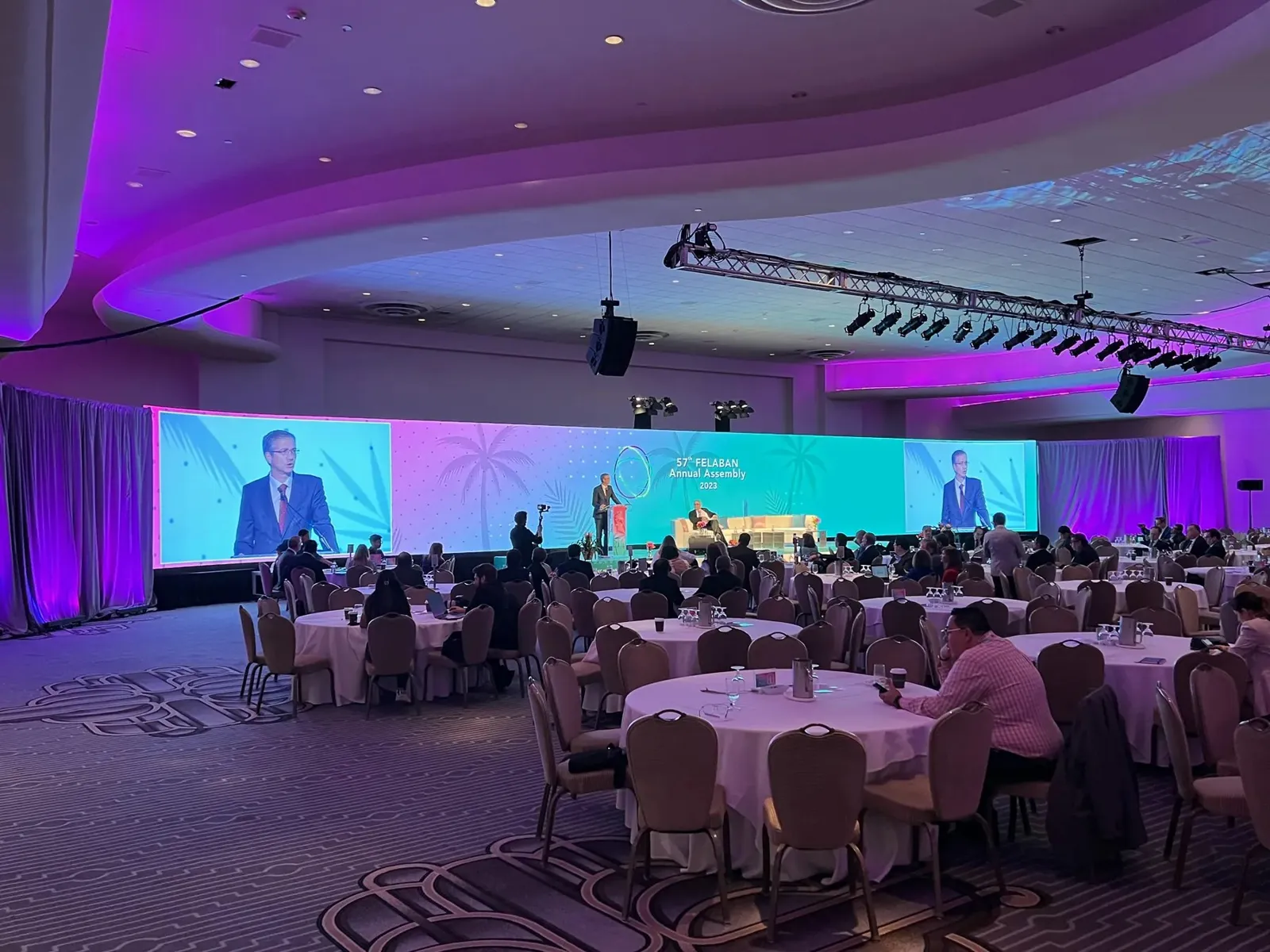Ballroom with a wide LED wall and purple lighting at the Fontainebleau Miami Beach, produced by Presentation Partners AV