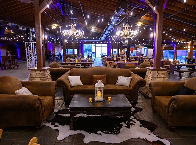 Lounge seating under string lights at an event venue