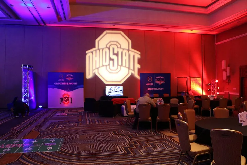 College football event with custom gobo projection and uplighting