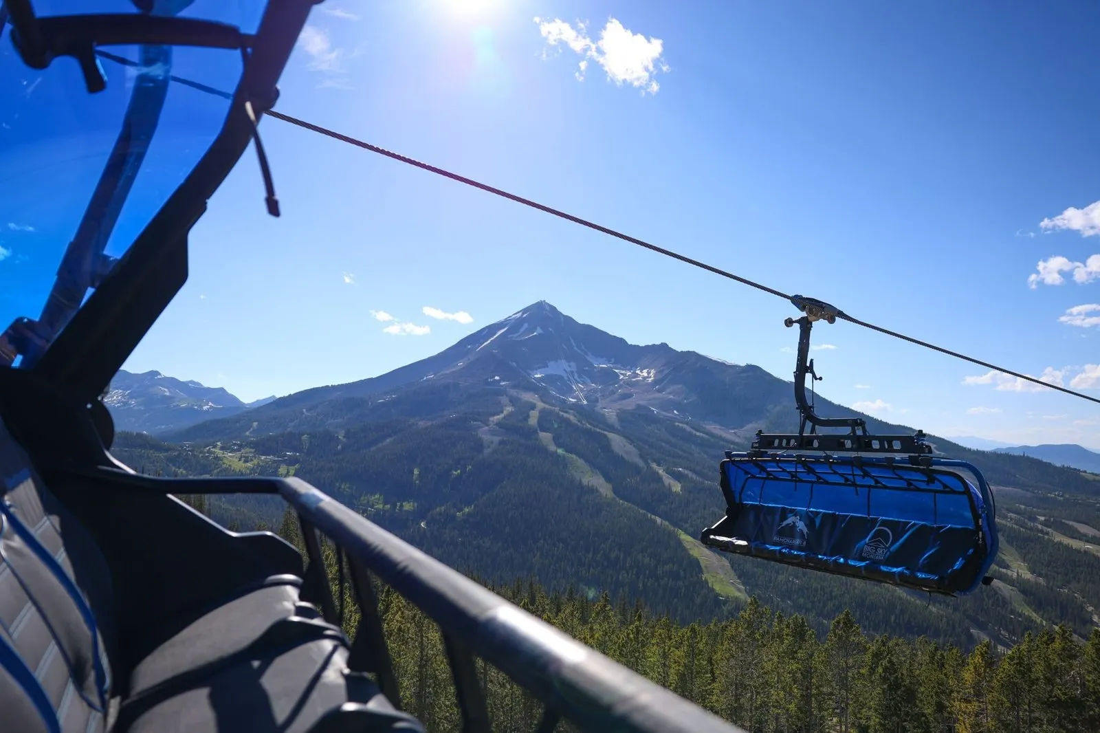 Chairlift rising toward Lone Peak on the way to an executive retreat dinner