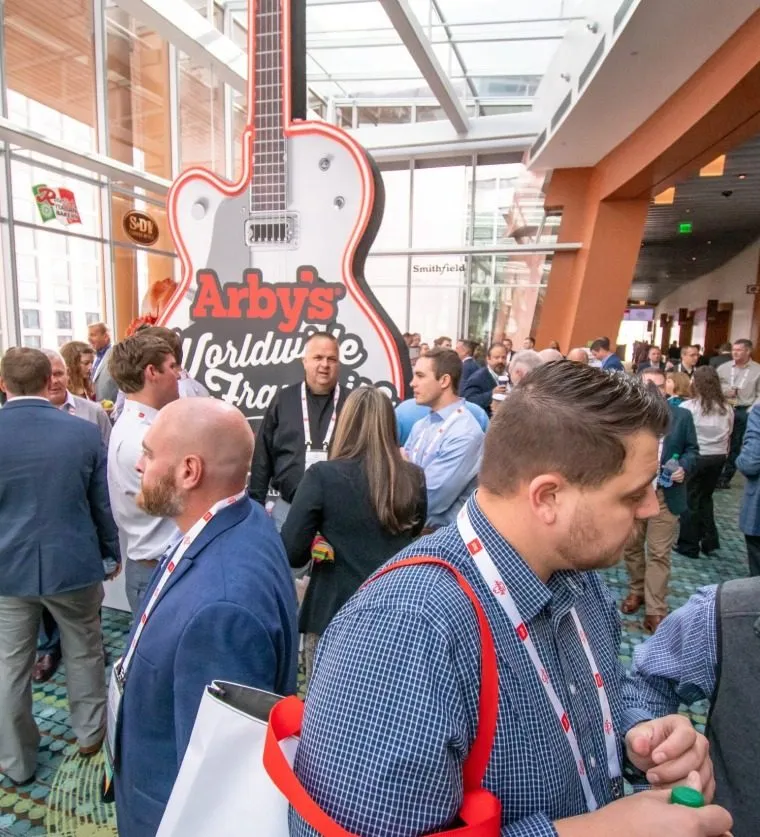 Attendees networking in a busy conference hall