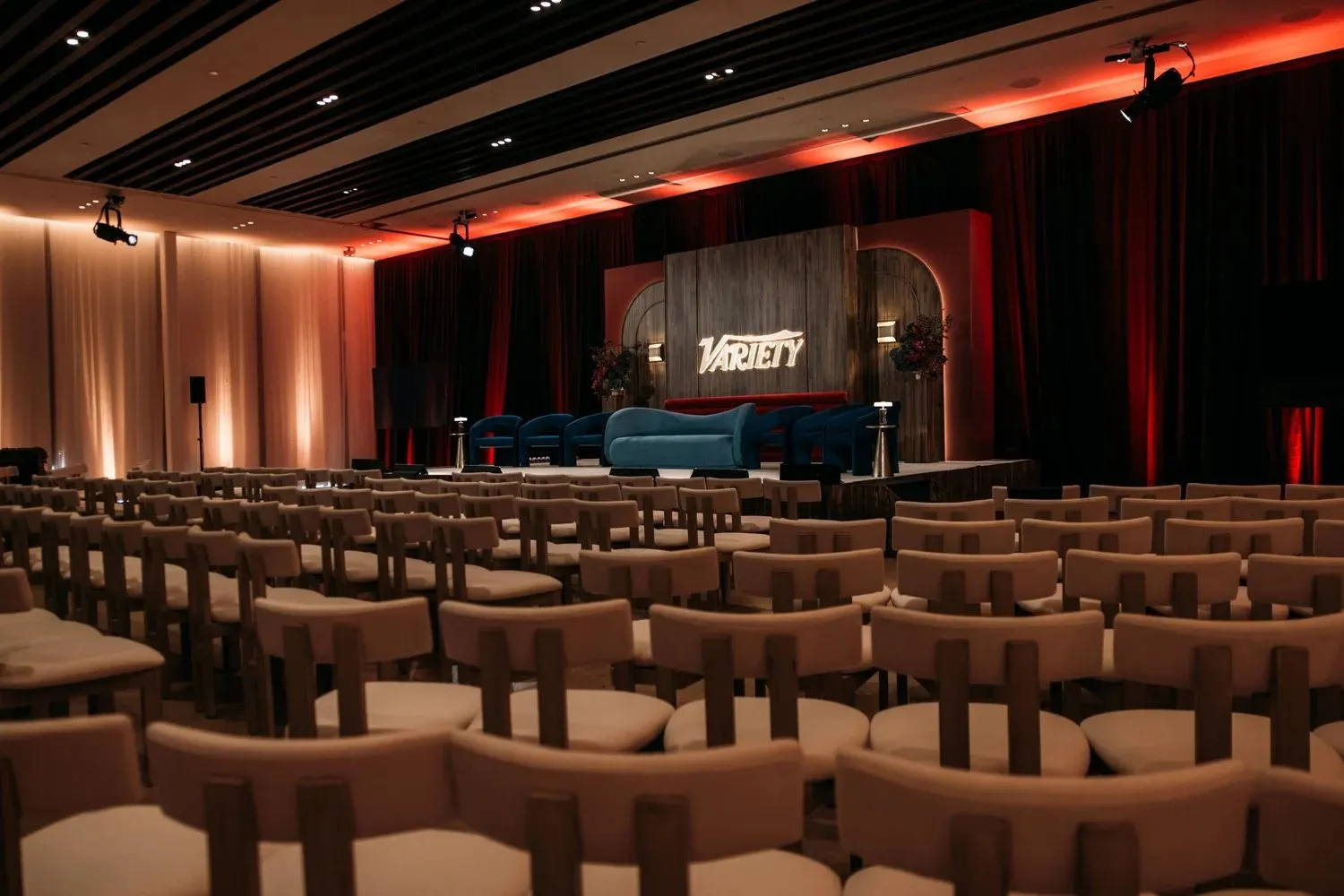 Audience seating facing a stage at a summit