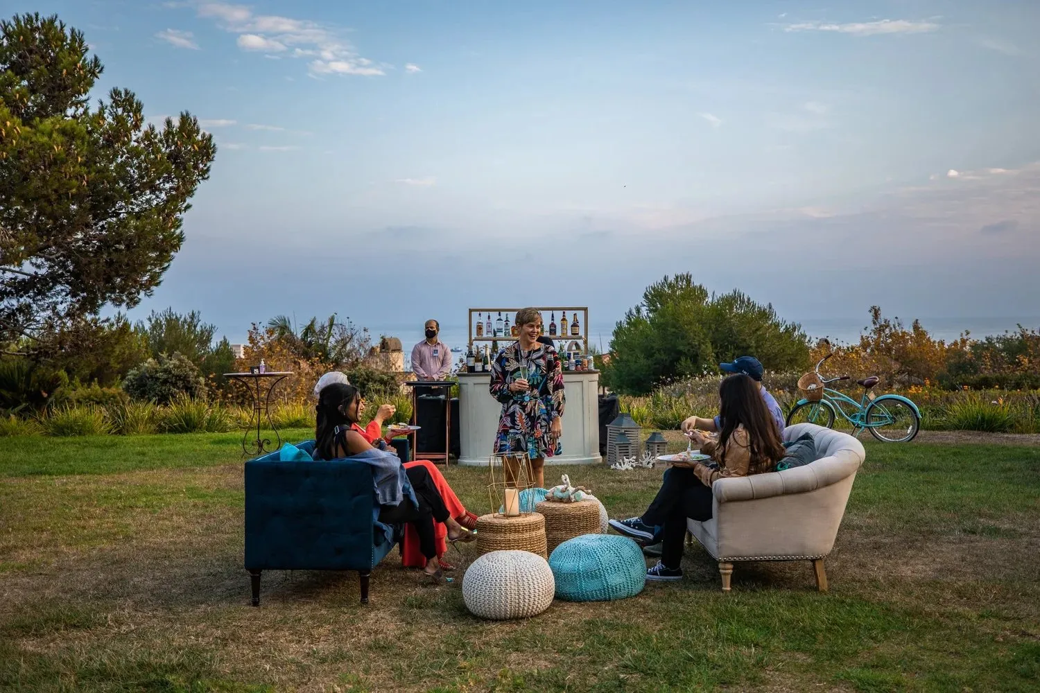 Outdoor lounge seating at dusk during a company offsite at Terranea