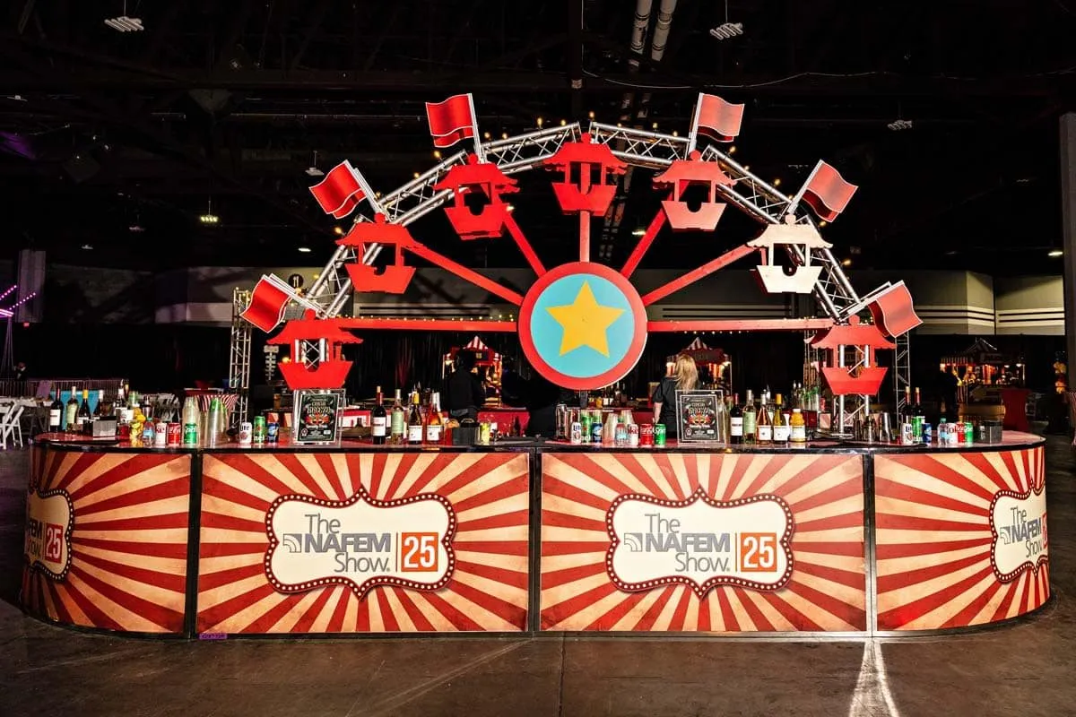 Carnival themed bar with a Ferris wheel facade built for a corporate event