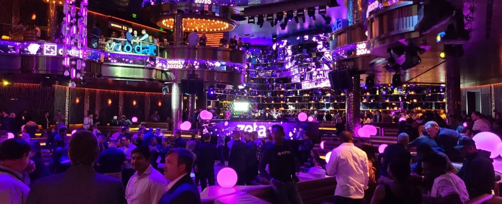 Evening event in a nightclub with lit tables and guests