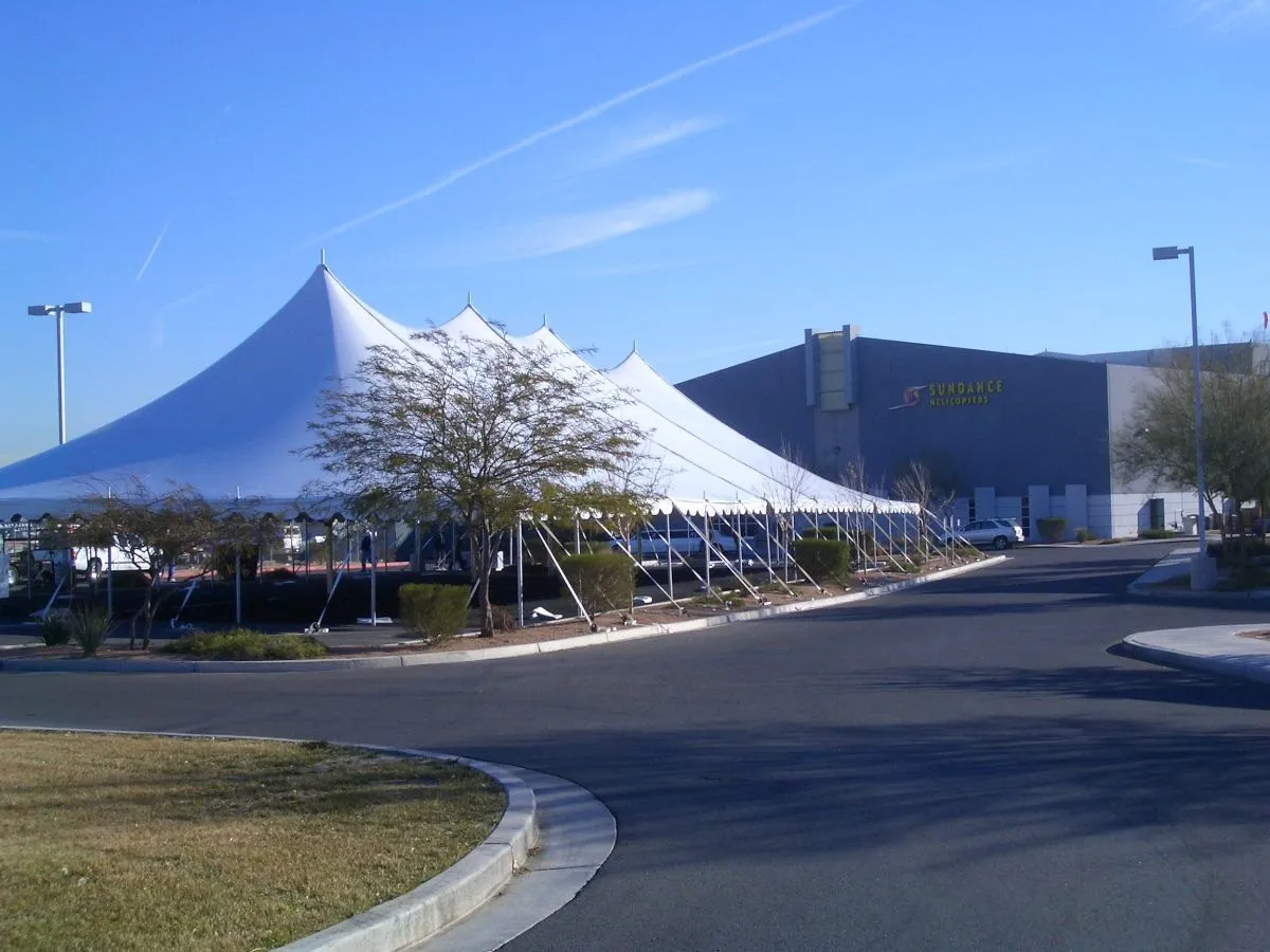 White event tents beside a road
