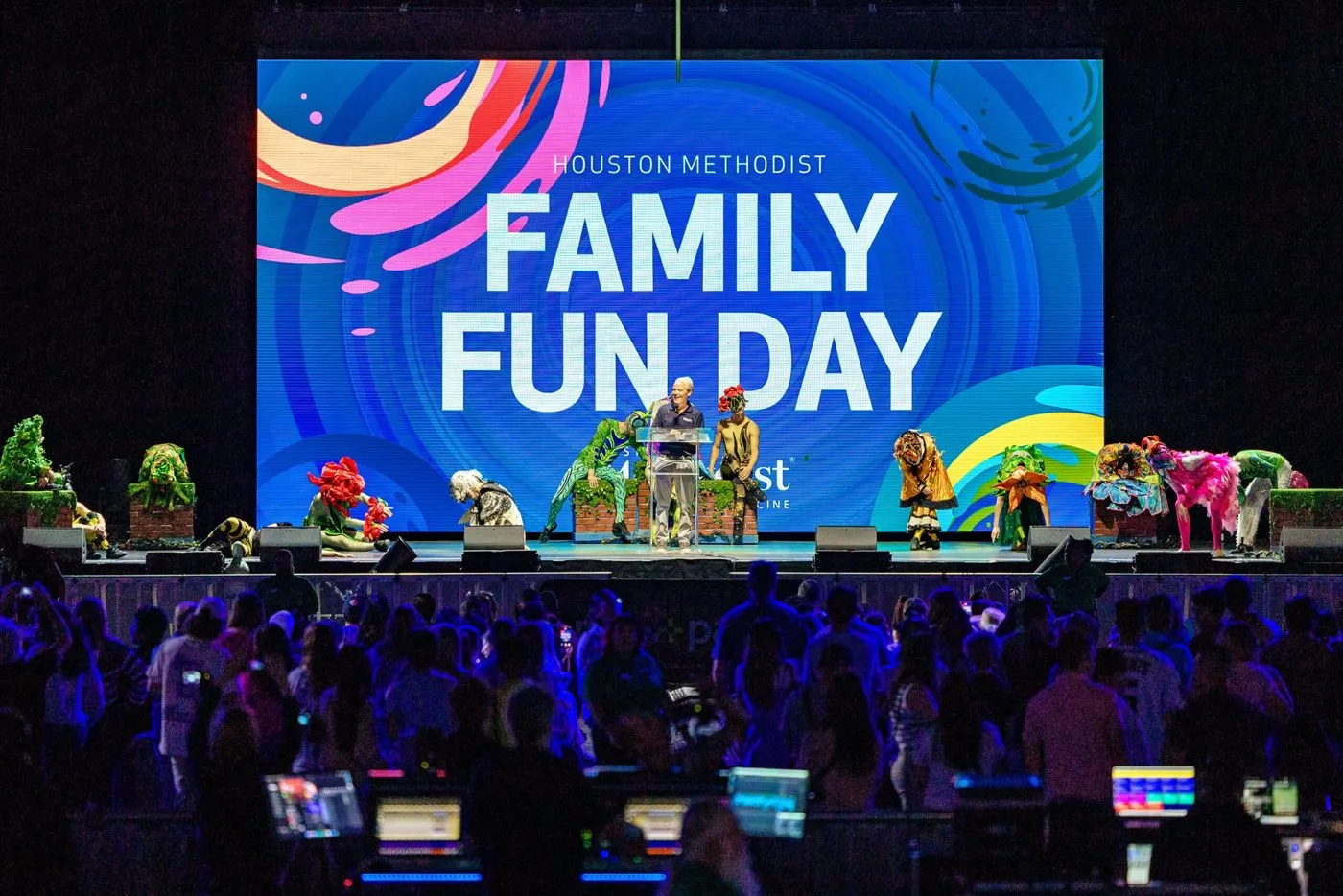 Company family day event on stage with a large LED screen