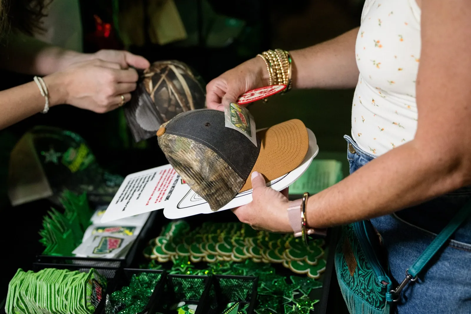 Guest customizing a hat at a hat bar activation
