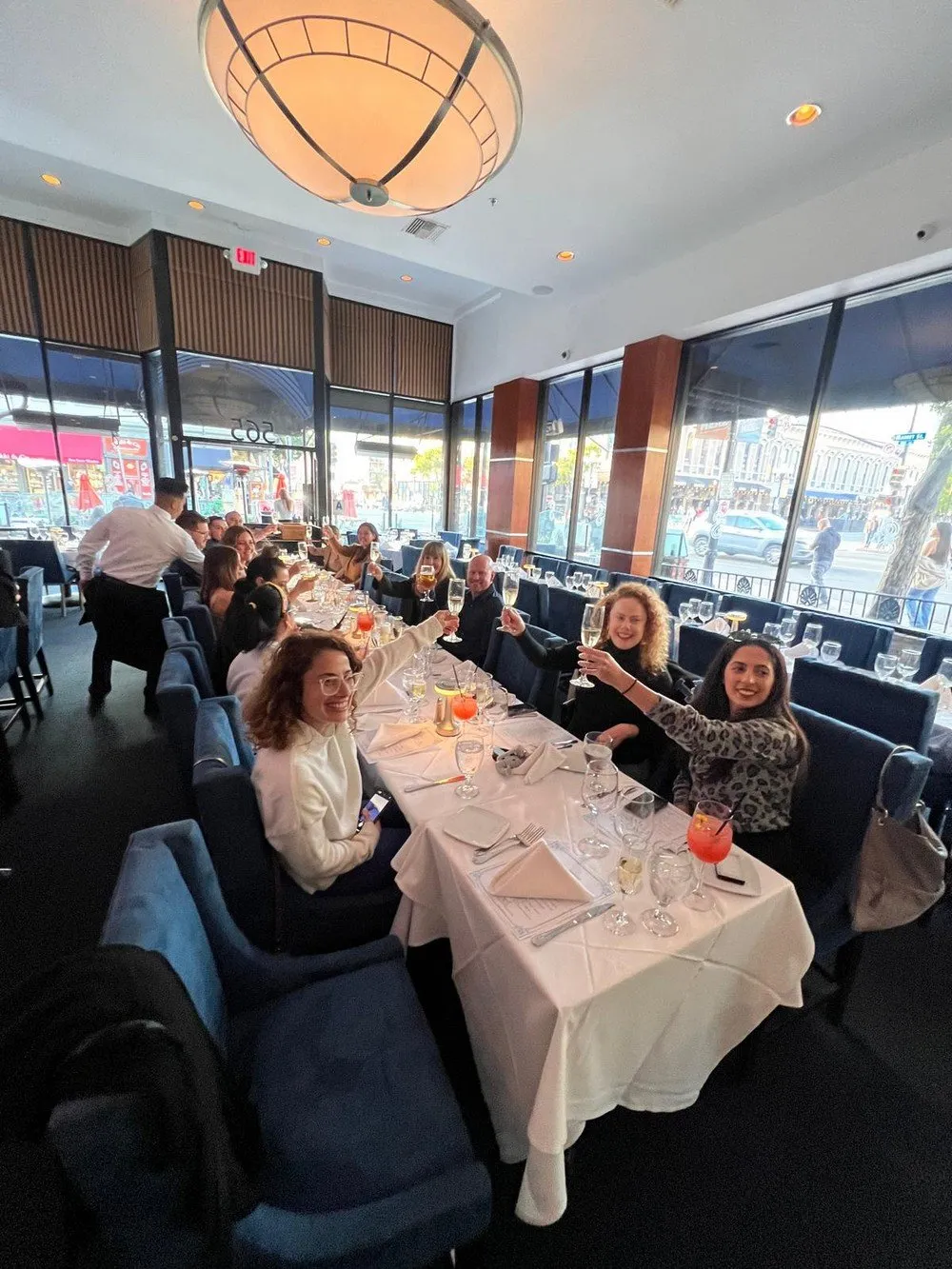 Guests seated at the Ryvu Therapeutics dinner by a window