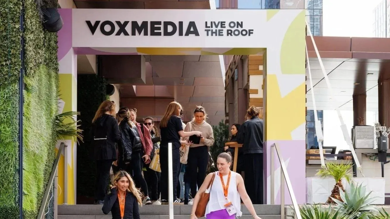 Guests entering a branded rooftop activation during a festival week