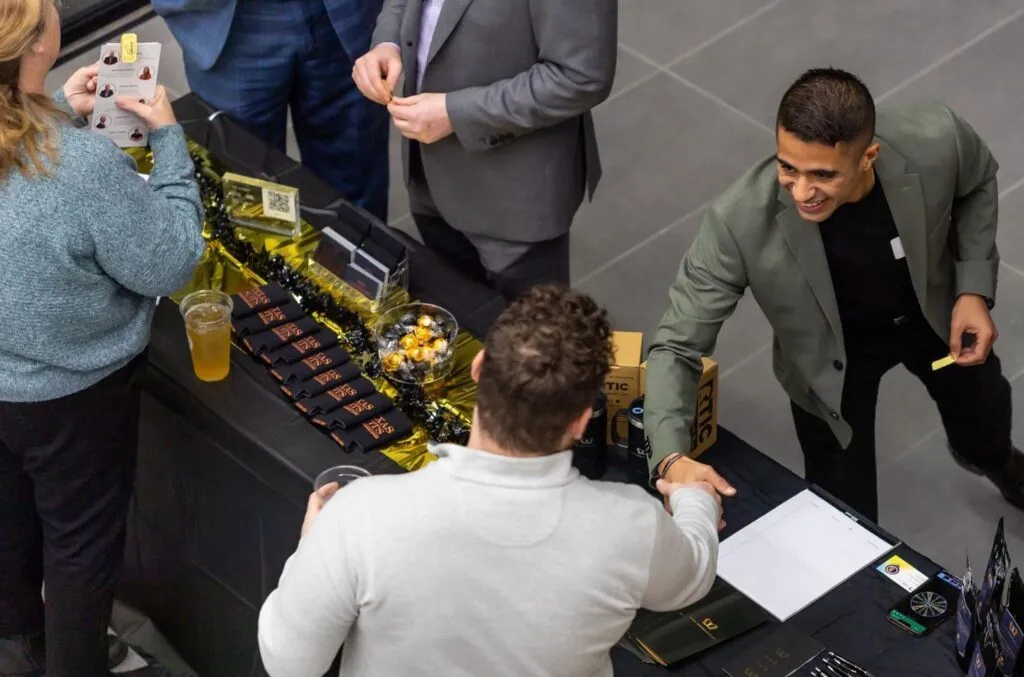 Guests talking at a table during a business event