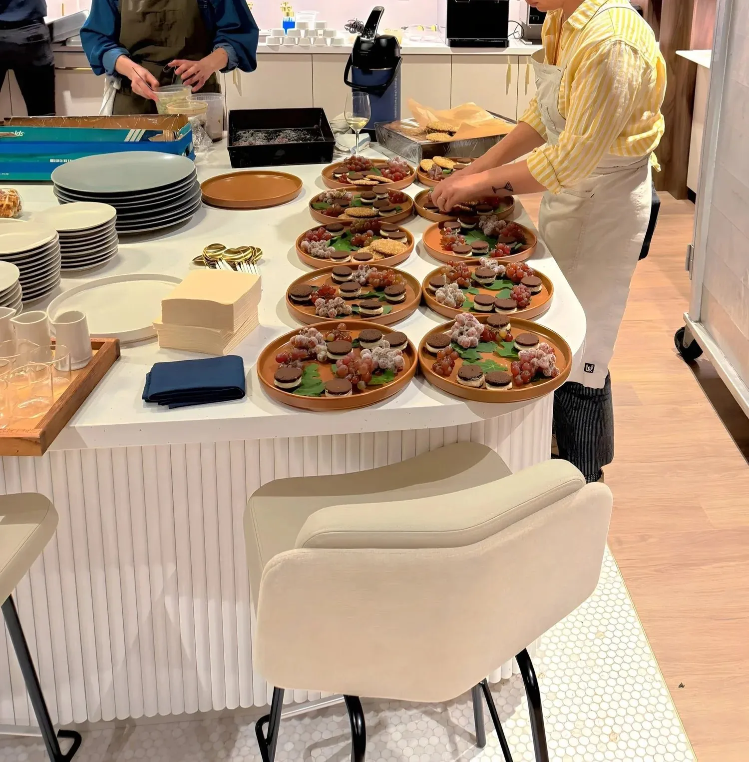 Chef plating dishes at a Schwabe client dinner produced by Perk Events