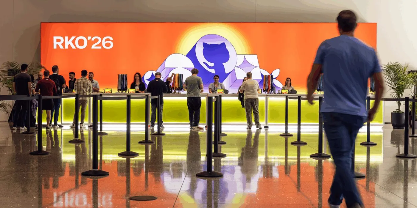 Attendees at a branded registration counter at a global sales kickoff