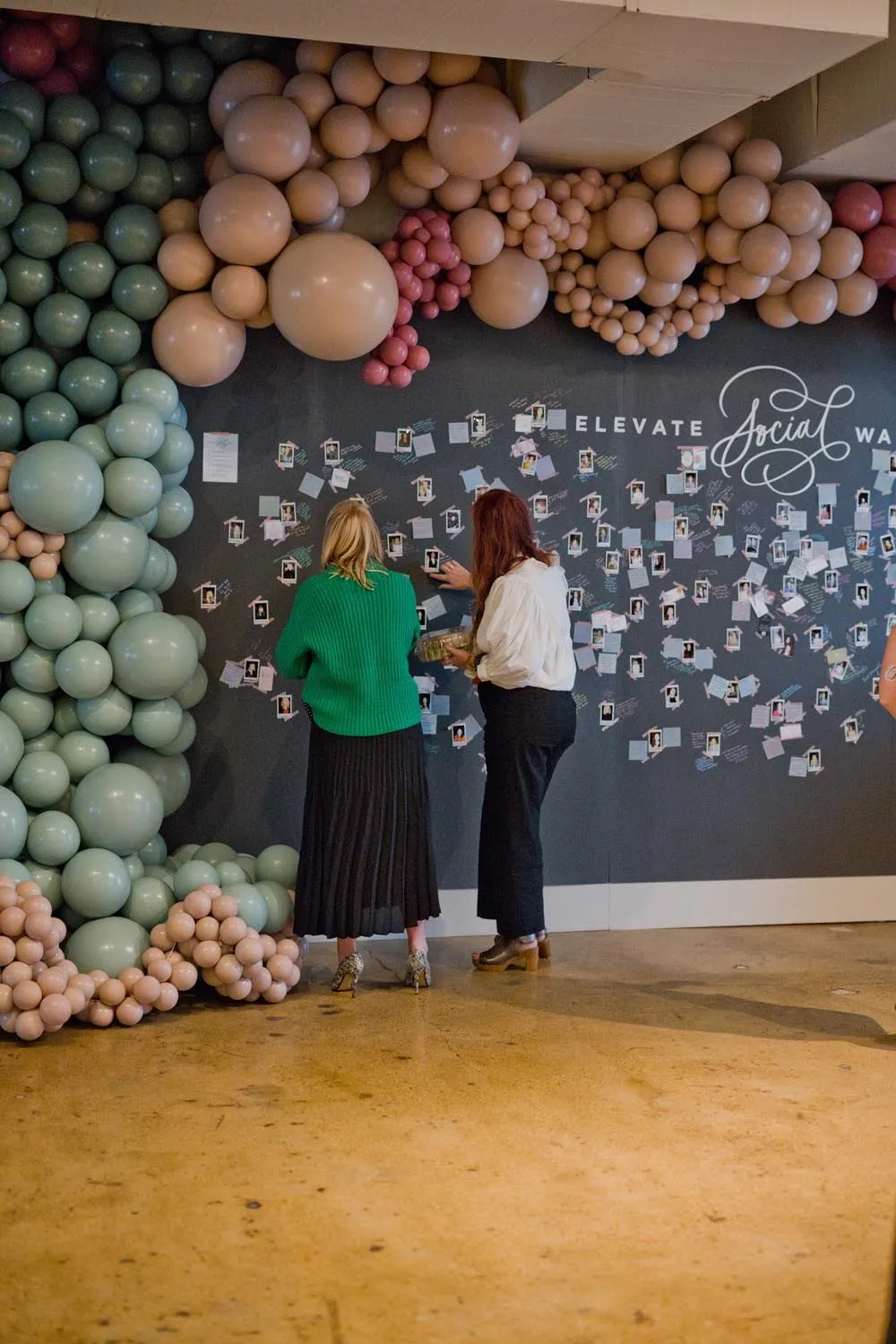 Balloon wall and signature board at the Elevate Summit
