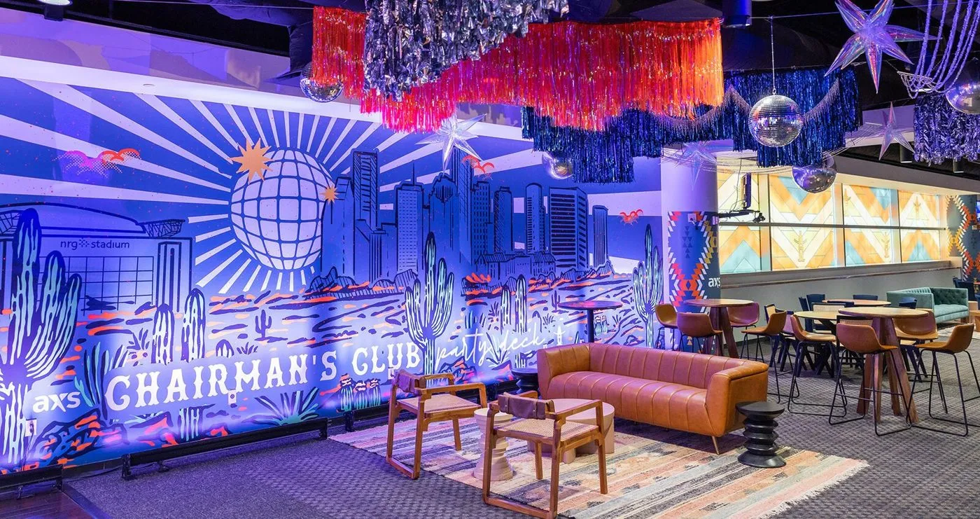 Branded corporate lounge with a lit entrance and seating areas