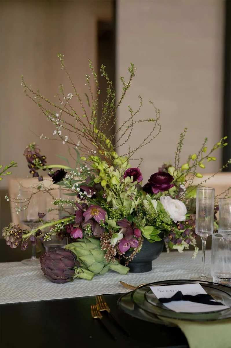 Tabletop floral arrangement with seasonal greenery