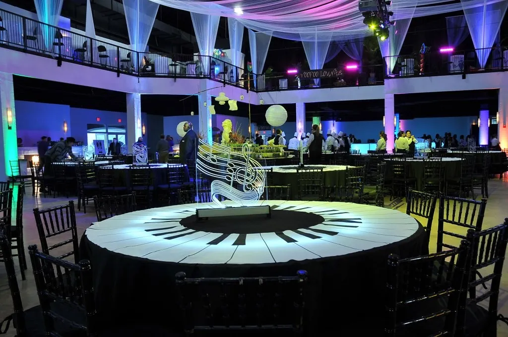 Evening reception with a lit bar and lounge seating