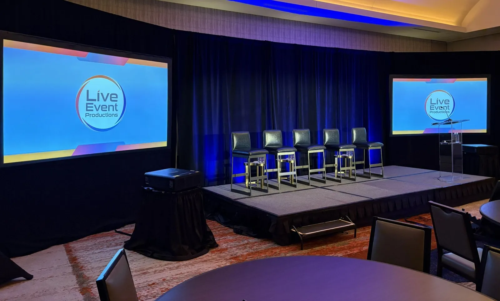 Stage with panel seating and screens
