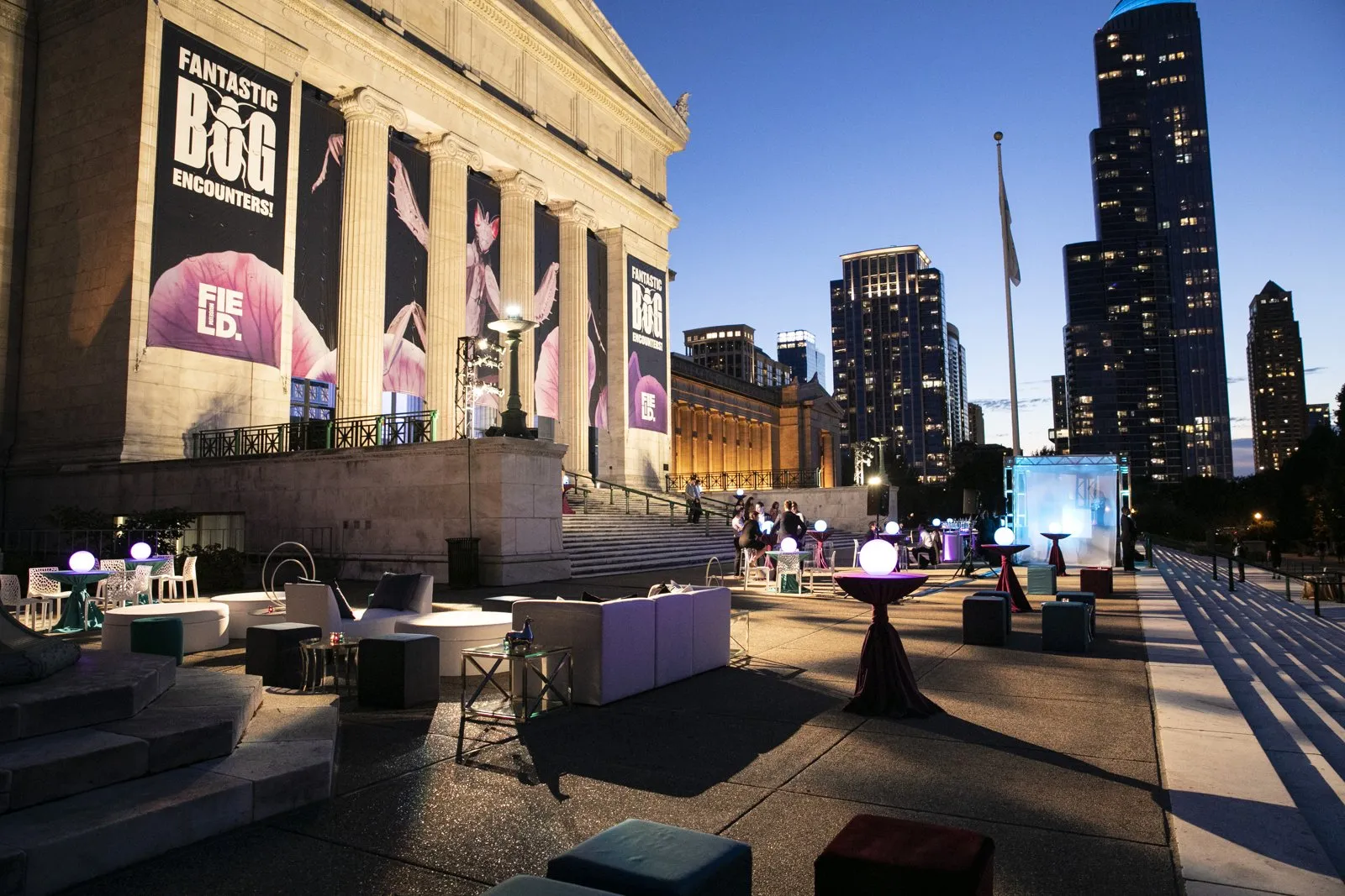 Evening reception with lounge seating and the Chicago skyline behind