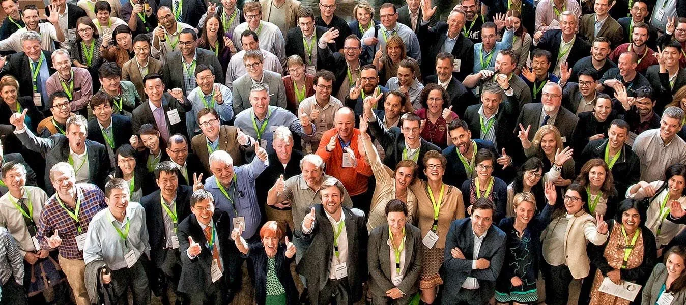 Large group of attendees photographed together at an event