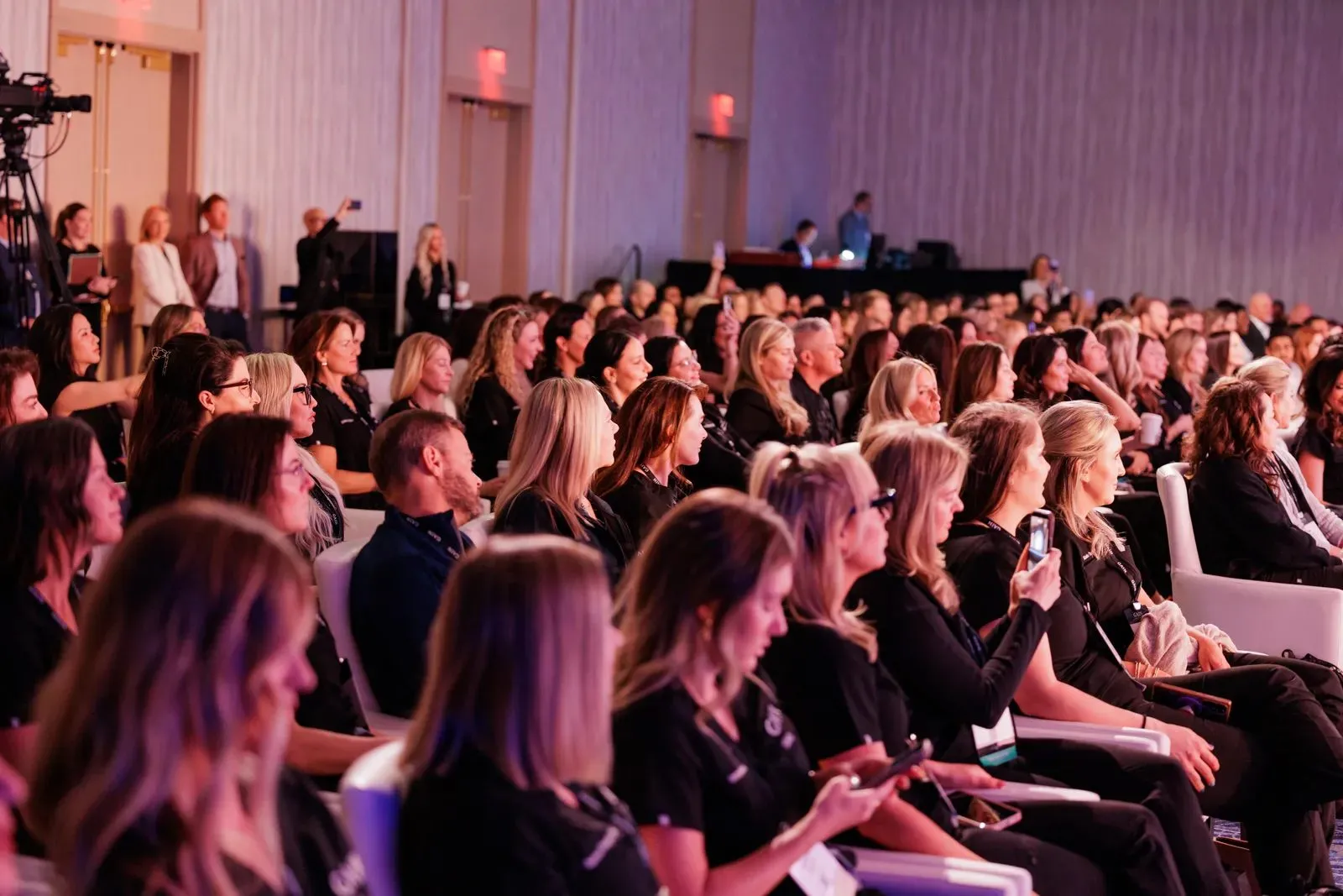 Full audience seated at a general session of a corporate program