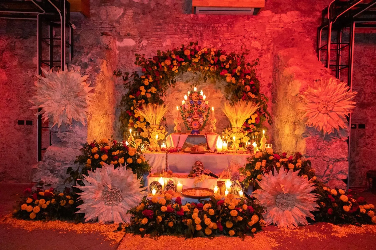 Floral installation lit in red for an evening at a San Miguel de Allende offsite