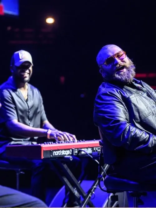 Musicians performing on stage at a live event