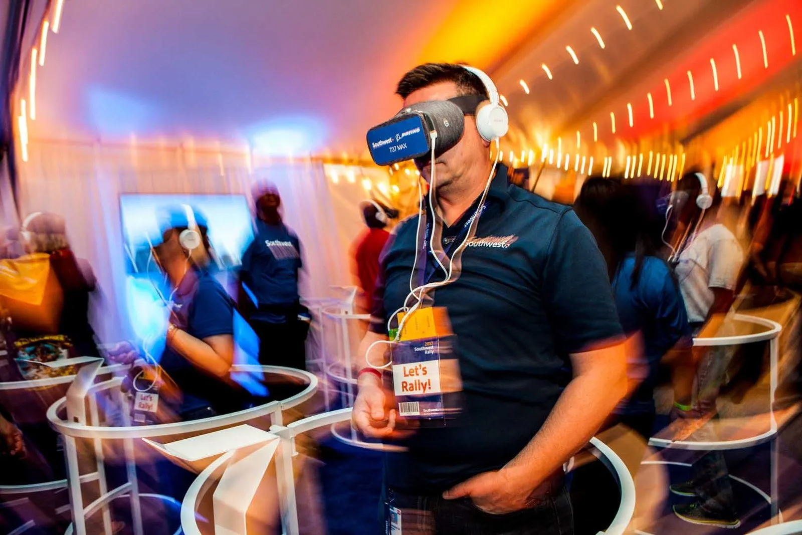 Attendee wearing a VR headset at an interactive station