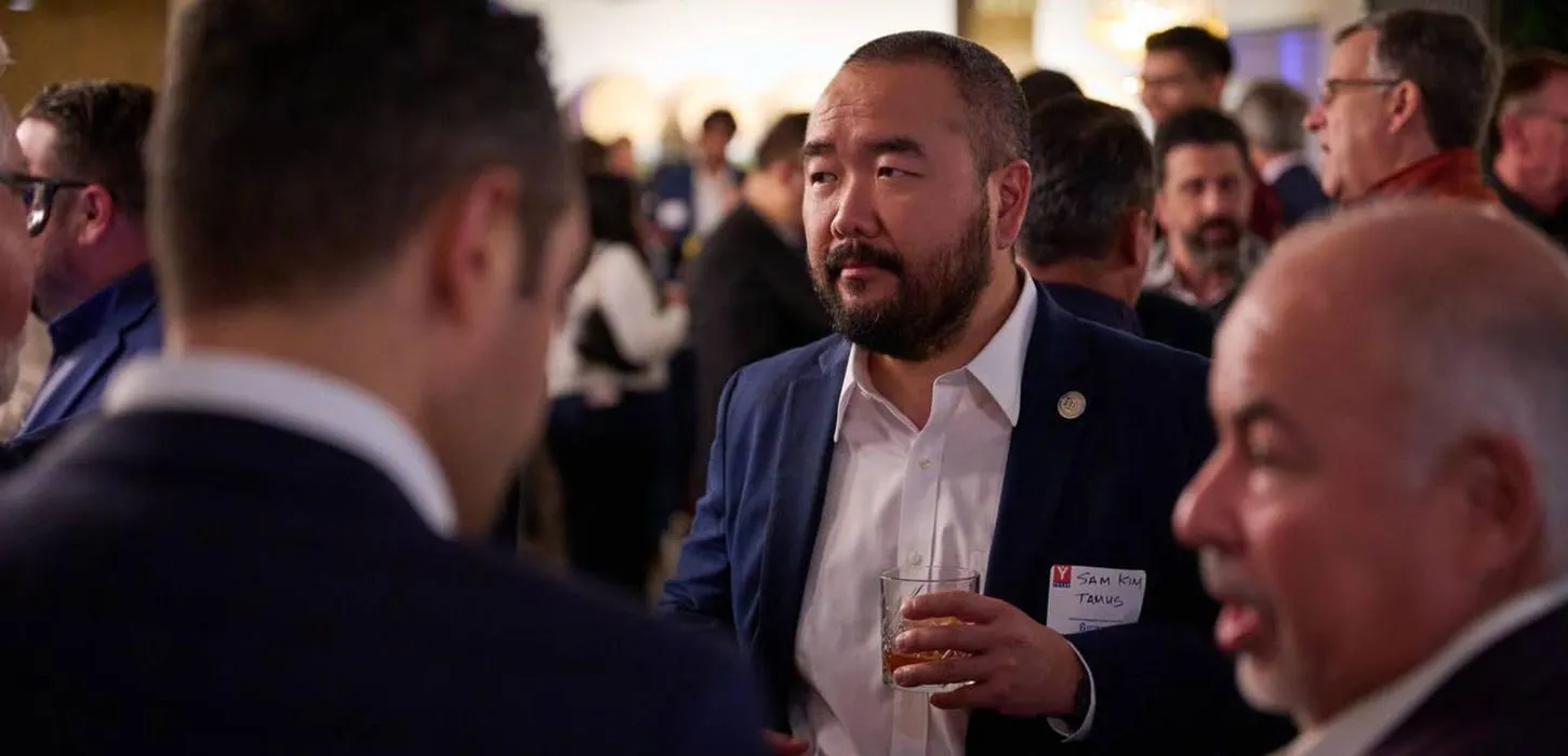 Attendees talking at a corporate networking event