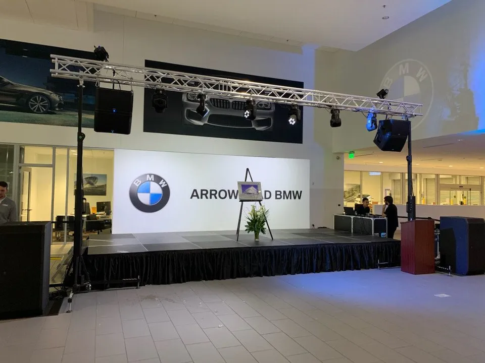 BMW dealership event with truss, lighting, stage and audio