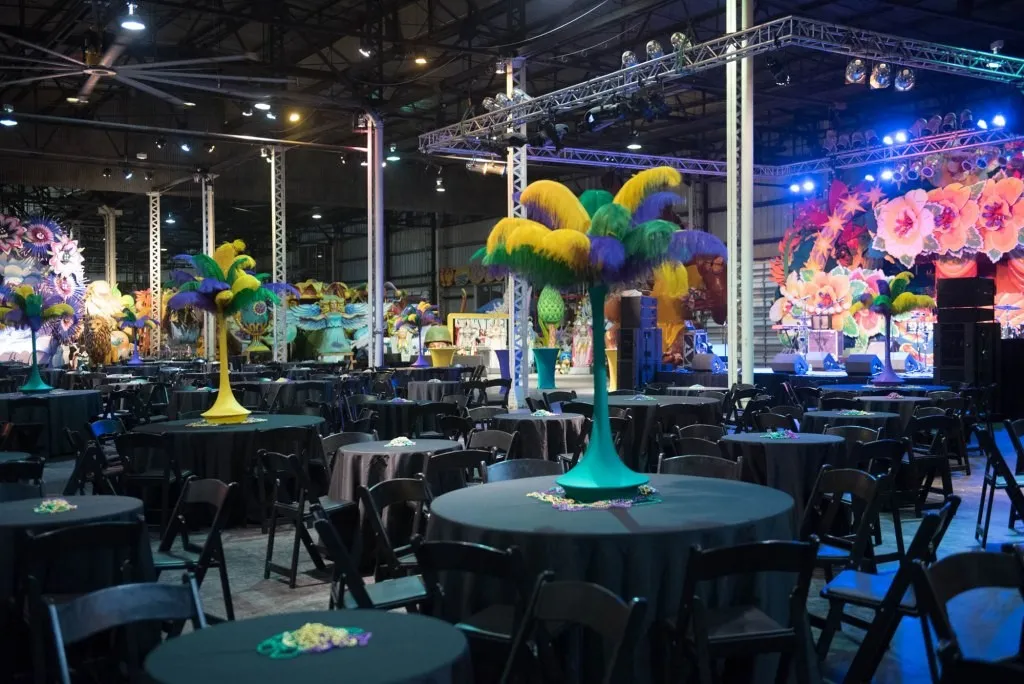 Gala tables with tall feathered centerpieces