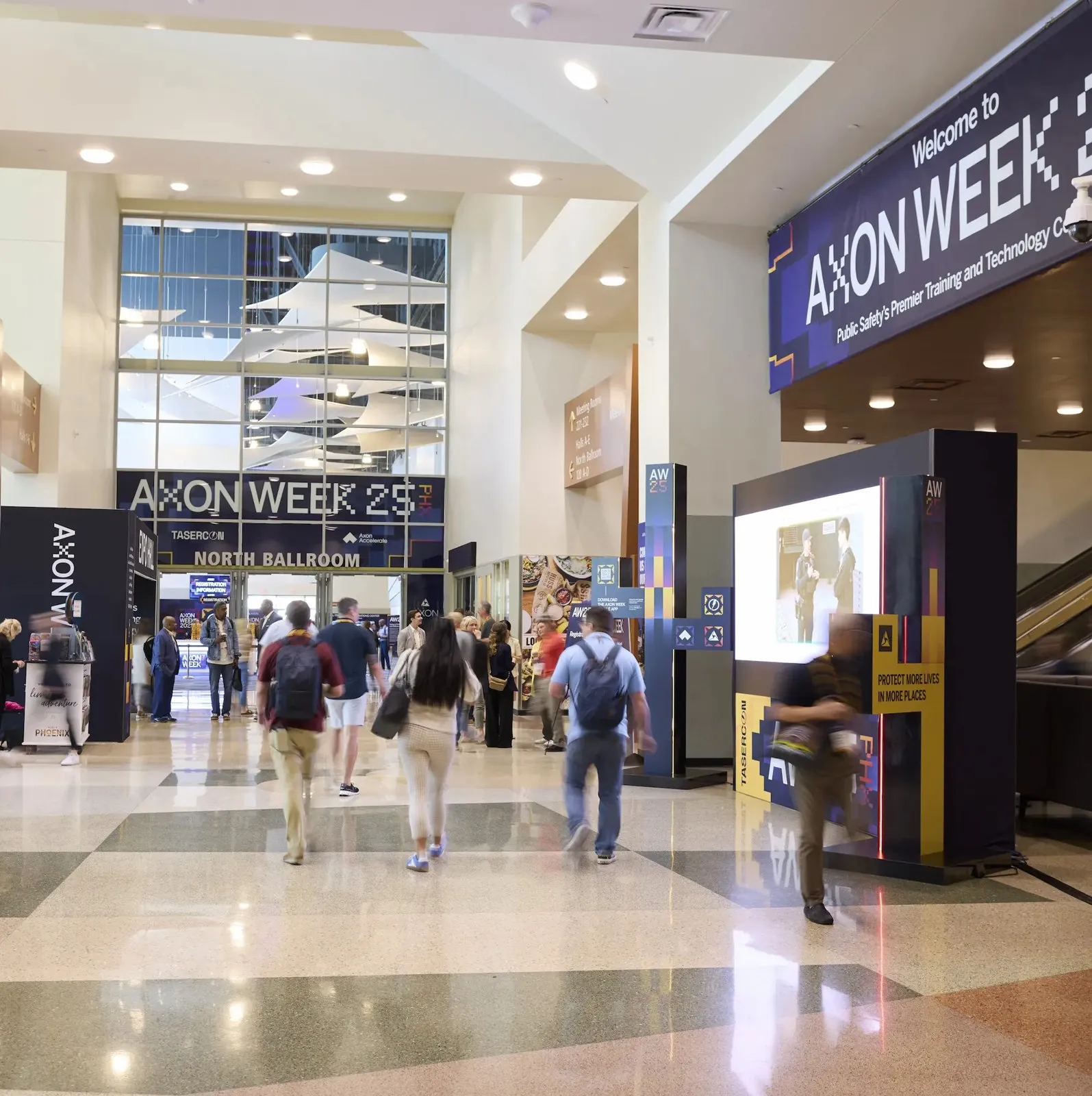 Branded "Axon Week" entrance and registration environment at a convention center, built by Highway 85 Productions