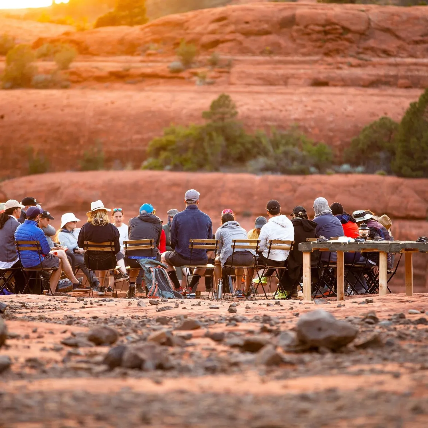 Long outdoor dinner table among the red rocks during IDEO's leadership retreat in Sedona