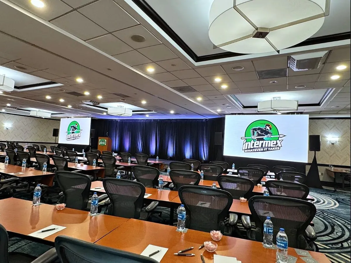 Shareholder meeting room with dual video walls and backlit drape
