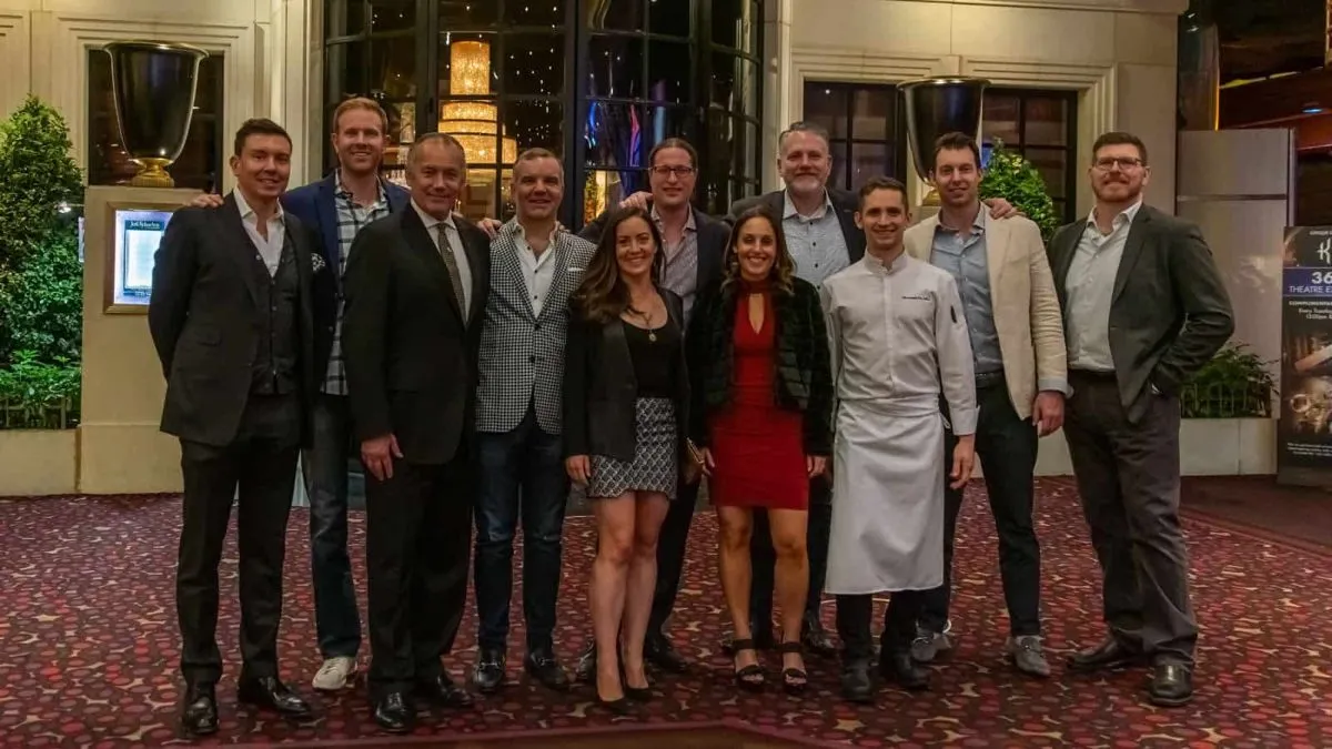 Group photo from the YPO Chicago retreat, with a chef in the center