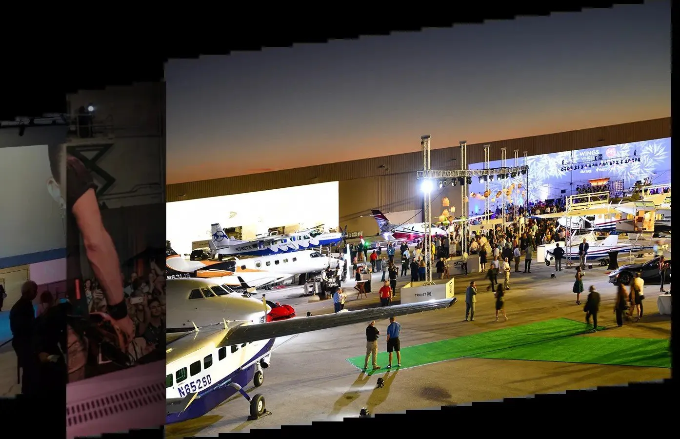 Guests at an evening reception among aircraft inside a hangar venue