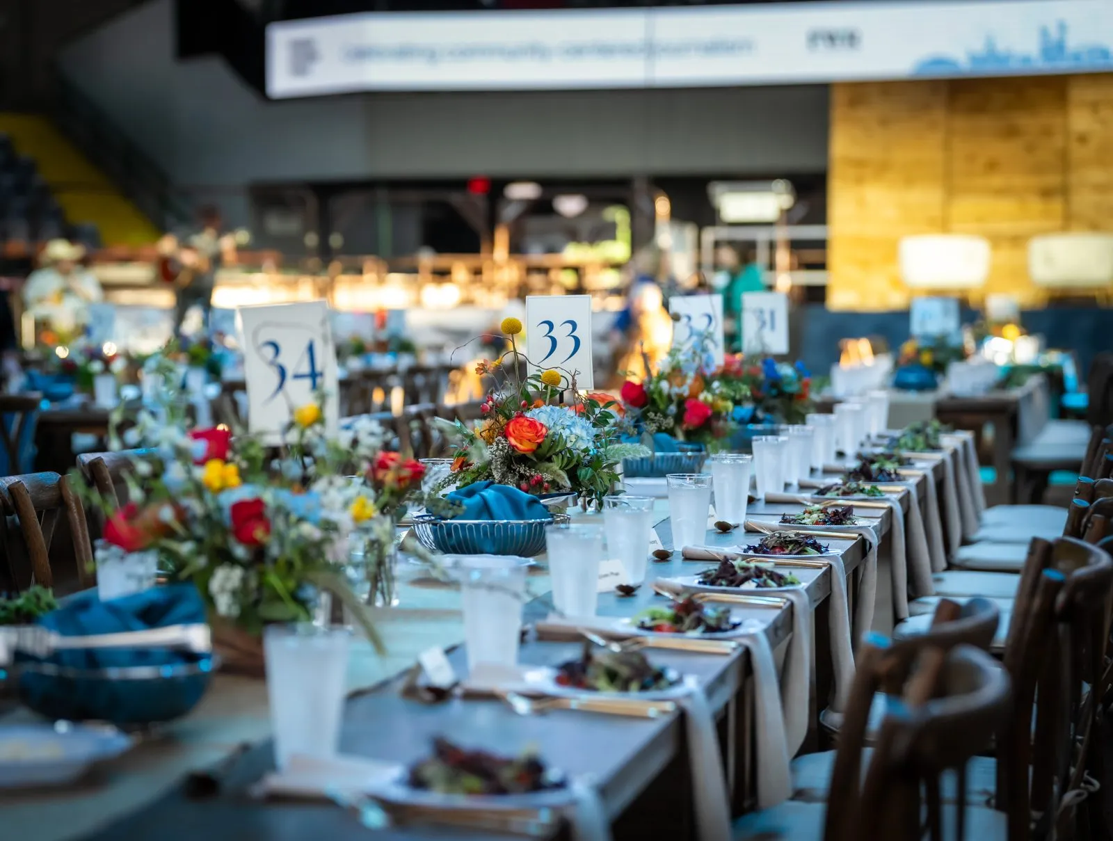 Banquet tables set with floral centerpieces at a venue