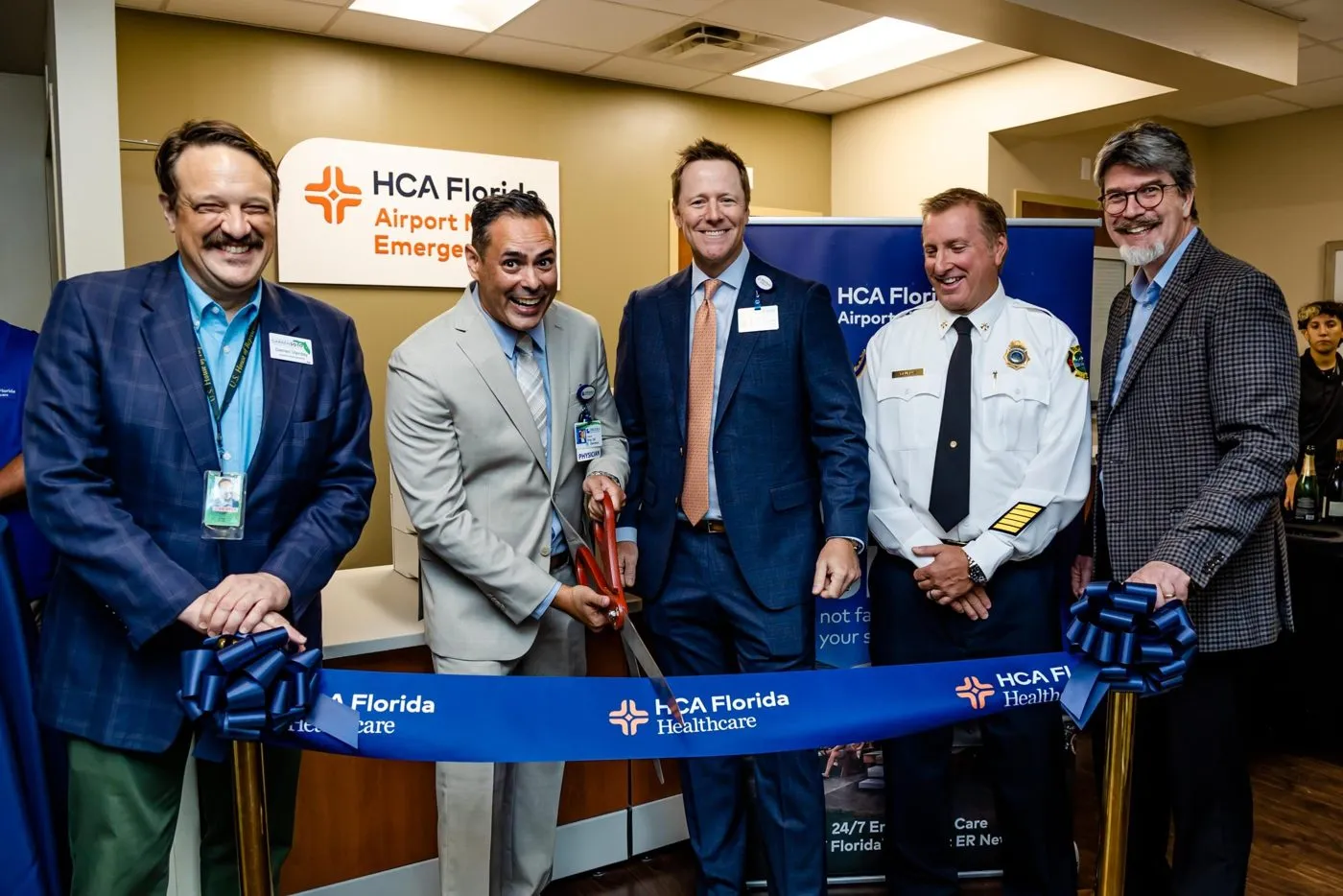 Healthcare company team at a ribbon cutting ceremony