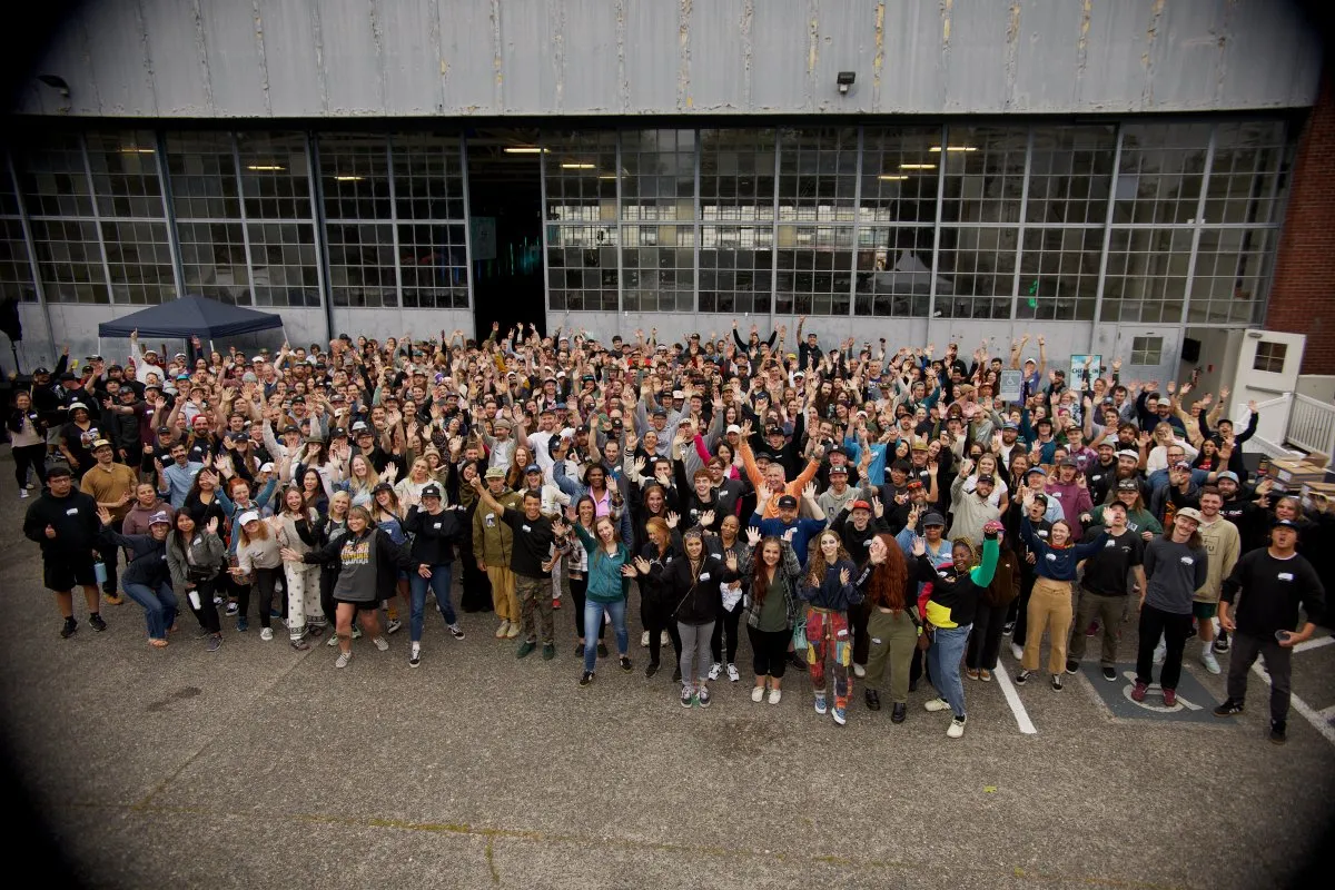 Company-wide retreat group photo outside the Magnuson Park hangar in Seattle