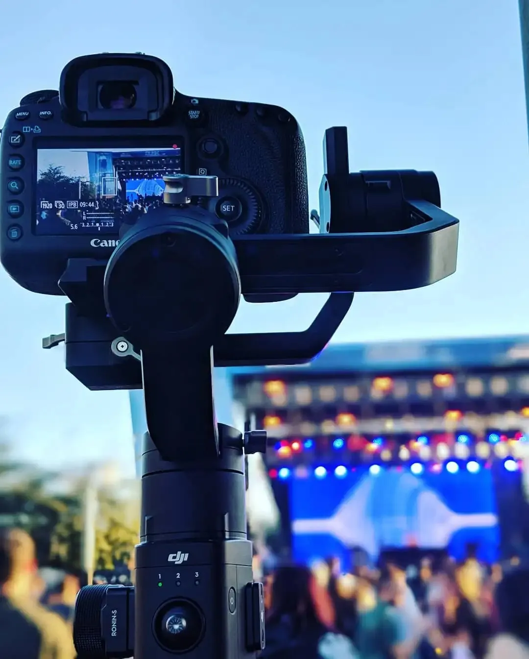 Gimbal camera filming an outdoor concert stage