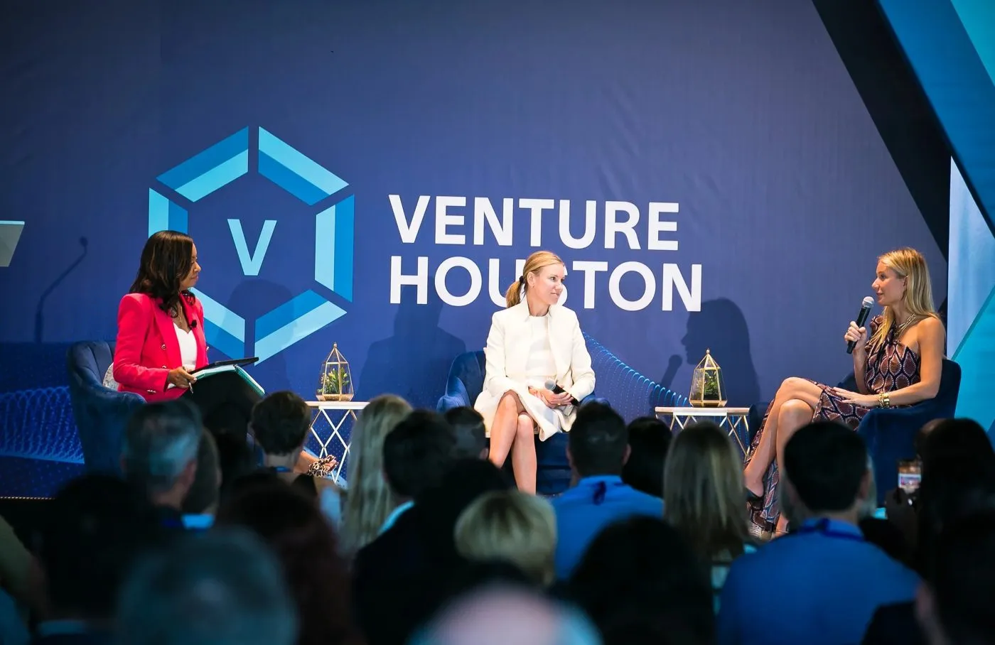 Panel conversation on stage at a Houston innovation conference