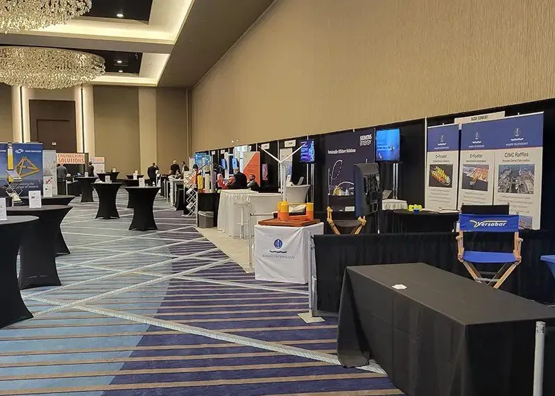 Convention hall with exhibitor booths and meeting areas