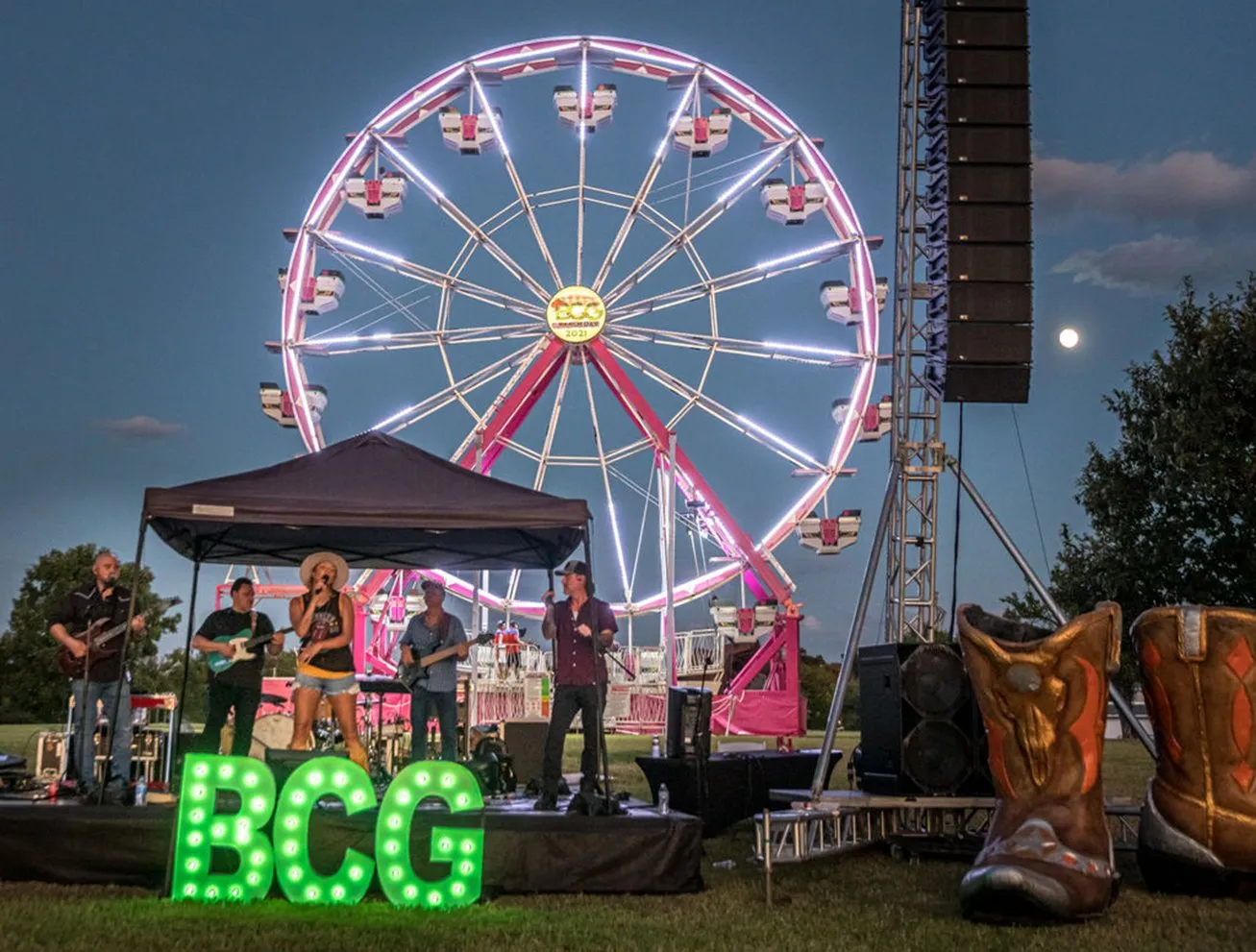 Ferris wheel and lit BCG letters at dusk during the BCG corporate ranch day