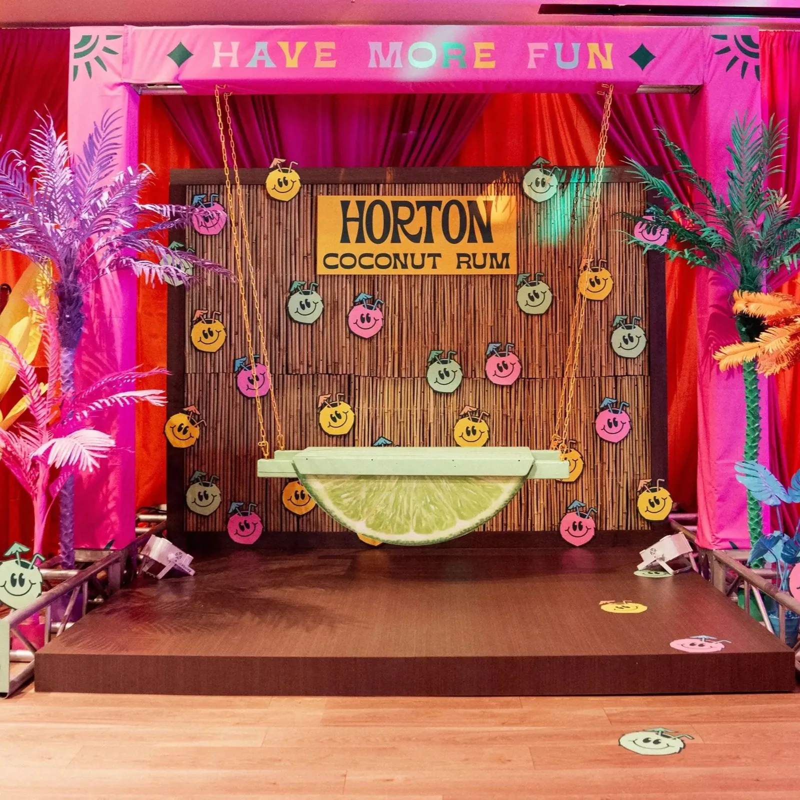 Tropical-themed Horton photo backdrop with floral and neon accents