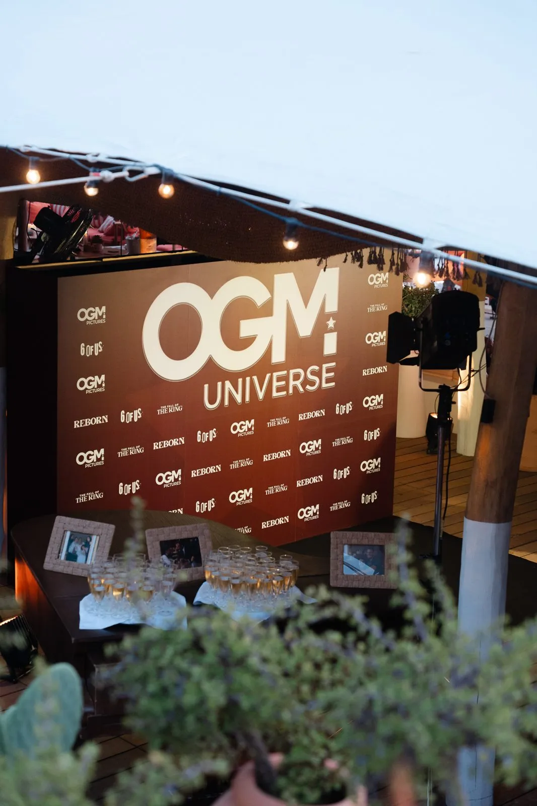 Branded sign at the entrance of an outdoor activation lounge