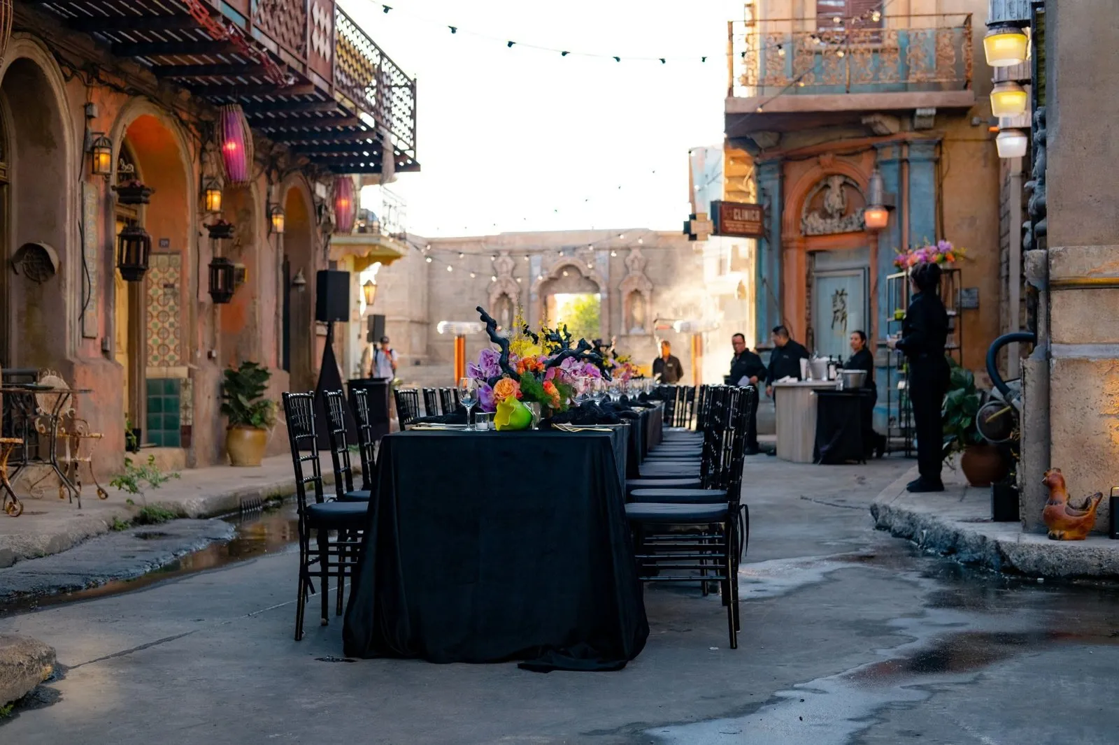 Dinner table set on the film set at Troublemaker Studios for a leadership offsite finale