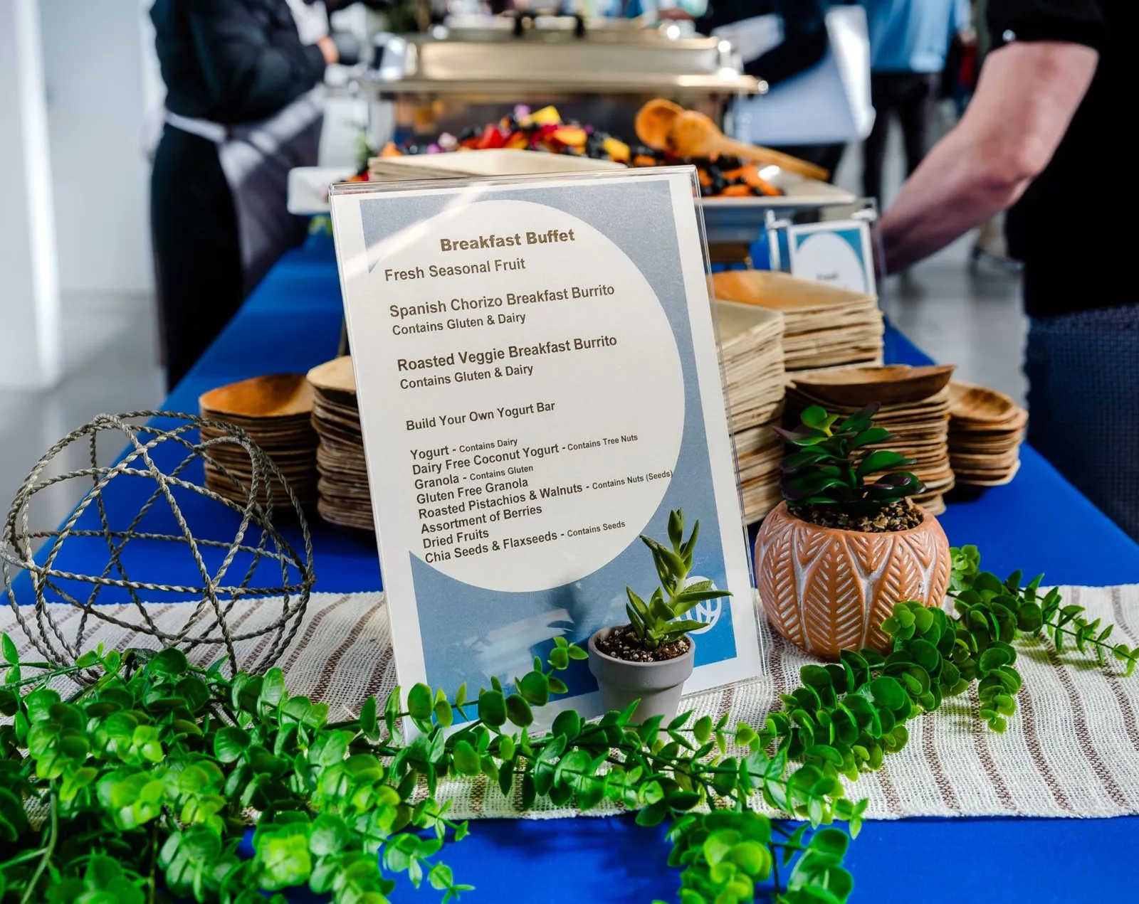 Buffet station with menu signage at Watershed's Fort Mason offsite