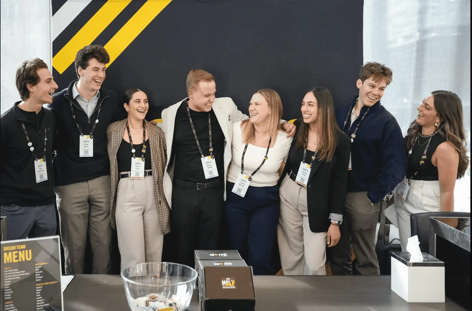 Event staff wearing lanyards gathered together at an event