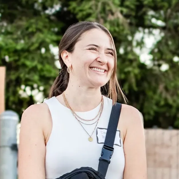 Danielle Briggs, founder of Danielle Briggs Consulting, smiling outdoors