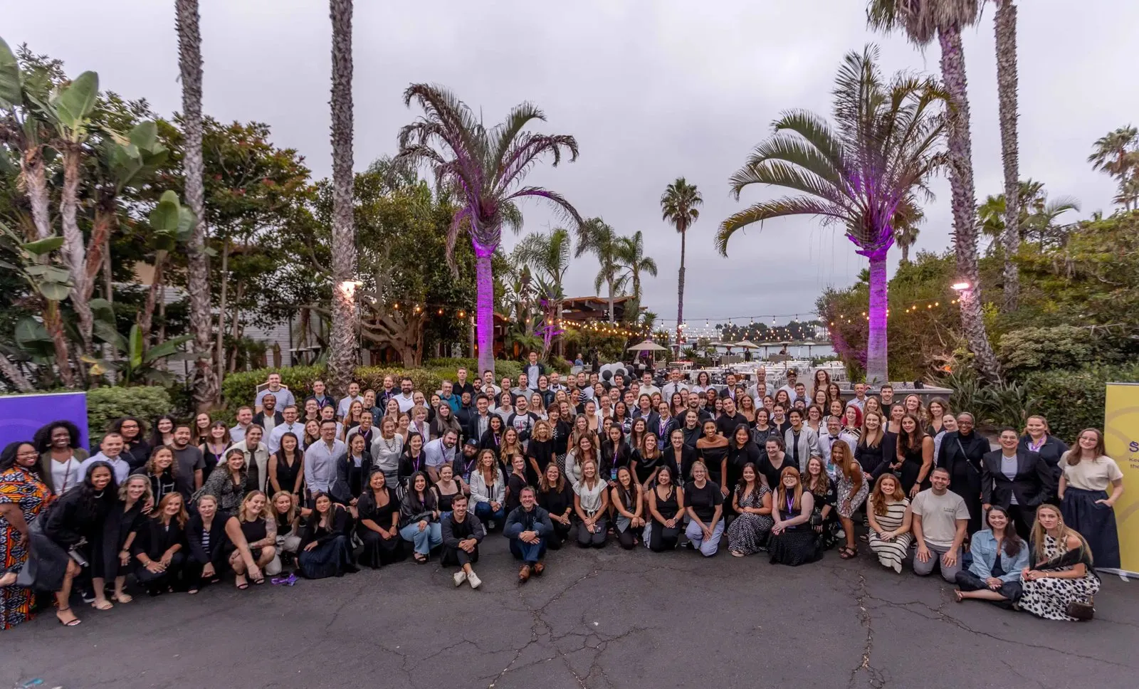 Seesaw team photo among the palm trees at Paradise Point Resort in San Diego